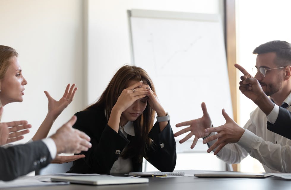 Frustrated millennial female worker felling tired of working quarreling.