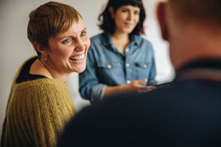 Businesswoman smiling during a meeting in office