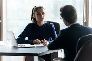Confident businesswoman hr manager listening to candidate on interview
